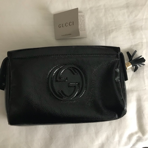 Gucci Handbags - Gucci black cosmetics bag 100% authentic